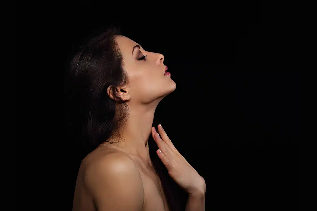 Beautiful makeup sexy woman touching the fingers elegant healthy neck skin